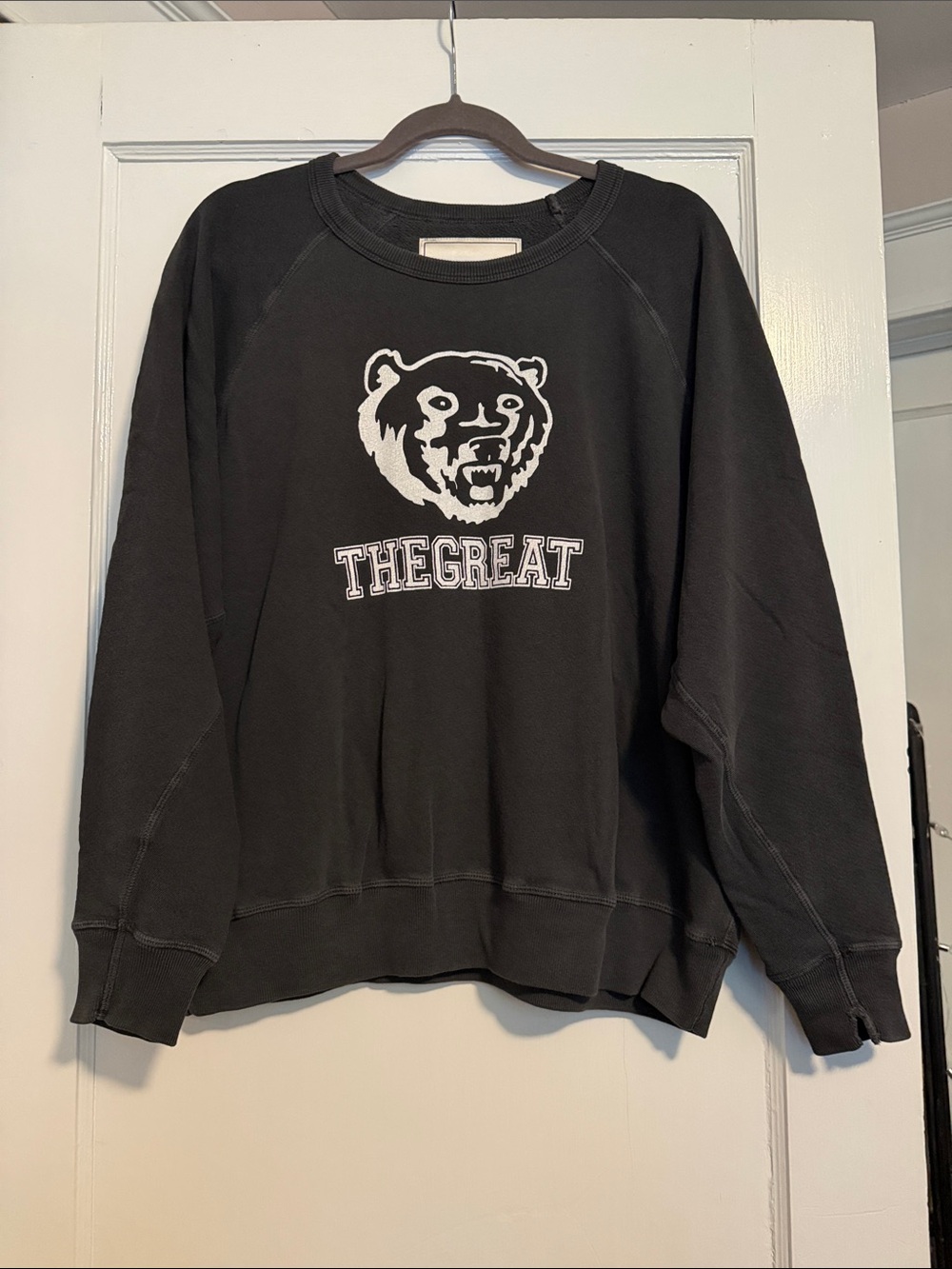 THE GREAT. Black Crewneck Sweatshirt with White Bear Logo